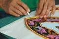 Malaysian kite maker working on a kite in his workshop Royalty Free Stock Photo